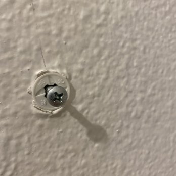 Anthem Handyman Services - This single anchor/screw was used to hang a heavy metal frame by the top of the metal behind the frame instead of the d ring hooks provided. - Handyman Near Me