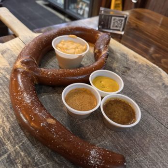 Prost! - Half of a jumbo hot pretzel with assortment of sauces for dipping - German Near Me - Chicago, Illinois Prost! - Half of a jumbo hot pretzel with assortment of sauces for dipping - German Near Me - Chicago, Illinois