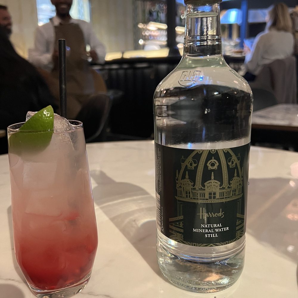 Kama by Vineet - I got the lychee pomegranate mocktail and some water. The mocktail was very good! Perfect combination of lychee and pomegranate. - Indian Near Me - London, XGL