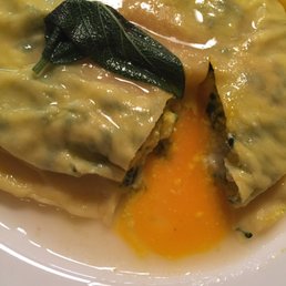Tortello with butter sage sauce and egg yolk inside