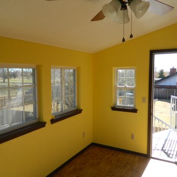 DT Remodeling - a room with yellow walls and wood floors - General Contractors Near Me DT Remodeling - a room with yellow walls and wood floors - General Contractors Near Me