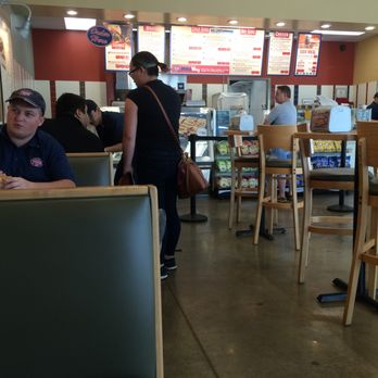 Jersey Mike's Subs - One employee eating and talking w friend, one employee playing with his baby/talking to wife, one employee actually working behind counter. - Sandwiches Near Me - League City, Texas