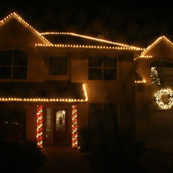 Dennington Decor - Candy Cane columns. 6 Inch spacing on Lights on roof. - Holiday Decorating Services Near Me - Austin, Texas Dennington Decor - Candy Cane columns. 6 Inch spacing on Lights on roof. - Holiday Decorating Services Near Me - Austin, Texas