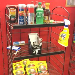 Allsup's Convenience Stores - What kind of shelf display is this? What's up with the Lysol hanging there by edibles?