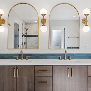 Virtual 360 Media - Timeless elegance: This double vanity features warm wood tones, gold accents, and a stunning blue tile backsplash. - Real Estate Photography Near Me Virtual 360 Media - Timeless elegance: This double vanity features warm wood tones, gold accents, and a stunning blue tile backsplash. - Real Estate Photography Near Me