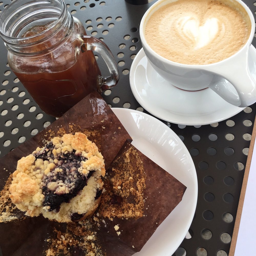 Lola's Cafe - Iced Americans Latte Blueberry muffin * baked goods delivered by vendor - Coffee & Tea Near Me - Ladera Ranch, California Lola's Cafe - Iced Americans Latte Blueberry muffin * baked goods delivered by vendor - Coffee & Tea Near Me - Ladera Ranch, California