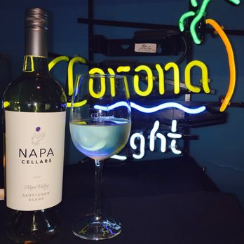 Corona Beach Bar - a glass of wine and a neon sign - Beer, Wine & Spirits Near Me - Los Angeles, California Corona Beach Bar - a glass of wine and a neon sign - Beer, Wine & Spirits Near Me - Los Angeles, California