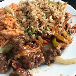 Vietnam Garden Restaurant - Pad Thai Noodles with Chicken, House Fried Rice, Ginger Beef, and Spicey Chicken with Cashews hidden under the rice. (Delivery)