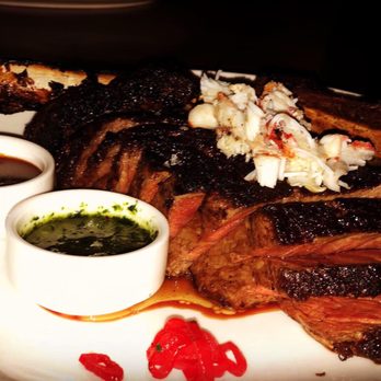 STK Steakhouse - 32 ounce tomahawk topped with crab with chimichurri sauce and Au polvre sauce - Bars Near Me - Denver, Colorado STK Steakhouse - 32 ounce tomahawk topped with crab with chimichurri sauce and Au polvre sauce - Bars Near Me - Denver, Colorado