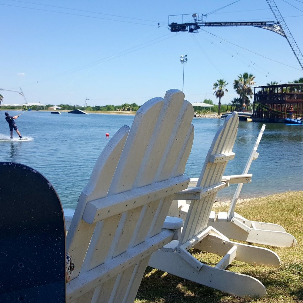 Texas Ski Ranch - Chilling out under the palm tree after a skateboarding session - Bars Near Me - New Braunfels, Texas Texas Ski Ranch - Chilling out under the palm tree after a skateboarding session - Bars Near Me - New Braunfels, Texas