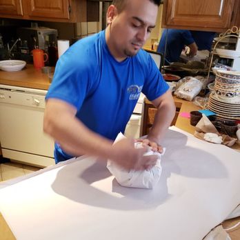 IPS NYC Moving & Storage - Paper packing those glass items for a save ride to storage. - Movers Near Me - Woodside, New York IPS NYC Moving & Storage - Paper packing those glass items for a save ride to storage. - Movers Near Me - Woodside, New York