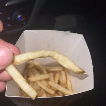 Whataburger - a hand holding a box of french fries - Burgers Near Me - San Antonio, Texas