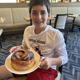 Giant cinnamon roll & one happy teenager.