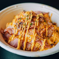 The Bite Club - Heavyweigh bowl, filled with crispy tots, crispy bacon, ham, and scrambled eggs.