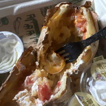 McAlister's Deli - Spud from McAllister's containing tomatoes, which I did not ask for. - Sandwiches Near Me - Owosso, Michigan