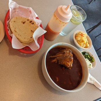 Tikalito - a table with food and condiments - Mexican Near Me - Ypsilanti, Michigan