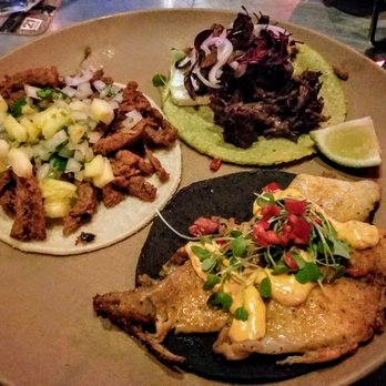 Machete Tequila + Tacos - Clockwise: Colorado Lamb, Fish, Al Pastor Tacos - Mexican Near Me - Denver, Colorado Machete Tequila + Tacos - Clockwise: Colorado Lamb, Fish, Al Pastor Tacos - Mexican Near Me - Denver, Colorado