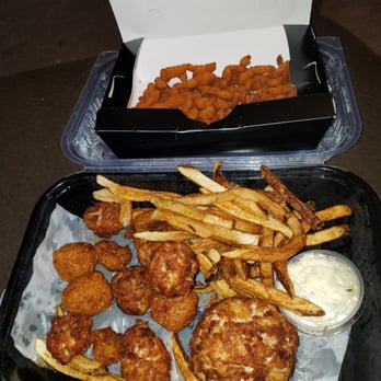 Casey's Crab Company - 29.99 Captain's platter Crab cake with 2 sides and 2 seafood choices. Crab balls and clam strips....fries and hush puppies. - Seafood Near Me - Laurel, Maryland