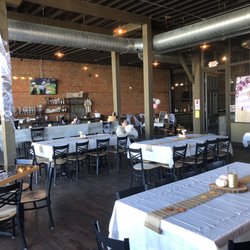 Stone Hollow Brewing Company - Th bar and tables for customers.