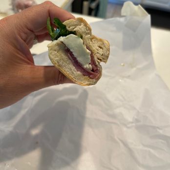 Sorrento's Brick Oven Pizzeria - a hand holding a sandwich - Pizza Near Me - Harvard, Massachusetts Sorrento's Brick Oven Pizzeria - a hand holding a sandwich - Pizza Near Me - Harvard, Massachusetts