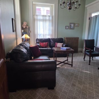 Inn at the Agora - Living room/common room with sofas - Hotels Near Me - Lewiston, Maine