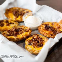 Back Streets Sports Bar - Potato Skins - Topped with a cheddar jack blend & bacon. Served with sour cream