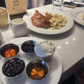 Mildred's Temple Kitchen - These are the sides to the pancakes. It's the whip cream, blueberries, and syrup that come with the blueberry pancakes. - Breakfast & Brunch Near Me - Toronto, Ontario