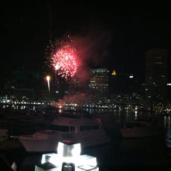 Rusty Scupper - View of the fireworks from our table during their New Years Eve Extravaganza. - Seafood Near Me - Baltimore, Maryland Rusty Scupper - View of the fireworks from our table during their New Years Eve Extravaganza. - Seafood Near Me - Baltimore, Maryland
