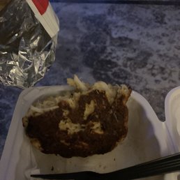 a piece of food in a styrofoam container a piece of food in a styrofoam container