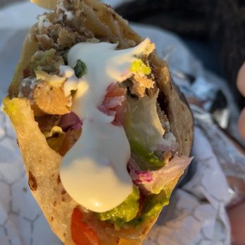 The Kebab Shop - D - San Diego Wrap with green and white sauce added - Mediterranean Near Me - Costa Mesa, California