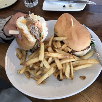 Benchmark Eatery - The bahn mi (also my fiancee's hand). - New American Near Me - Santa Barbara, California