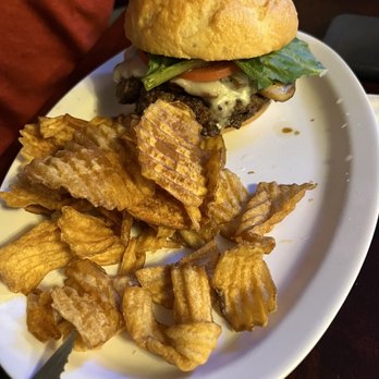 Blakeslee's Bar & Grill - Bacon mushroom burger on gluten free with homemade chips (shared fryer) - Bars Near Me - Forks, Washington Blakeslee's Bar & Grill - Bacon mushroom burger on gluten free with homemade chips (shared fryer) - Bars Near Me - Forks, Washington