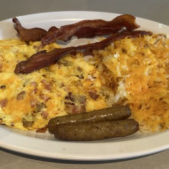 Lincoln Square Pancake House - Meat Lovers Scrambler, hash browns with cheese, sausage links & bacon. Great thick cut sourdough toast not pictured. - Cafes Near Me - Indianapolis, Indiana Lincoln Square Pancake House - Meat Lovers Scrambler, hash browns with cheese, sausage links & bacon. Great thick cut sourdough toast not pictured. - Cafes Near Me - Indianapolis, Indiana