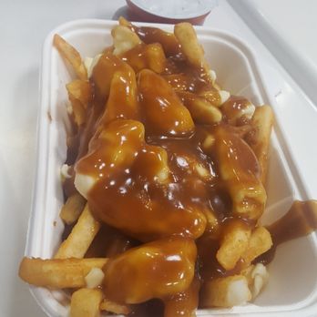 Costco - Poutine! Fries and gravy are so tasty here. The cheese curds were so big here too! - Wholesale Stores Near Me - Burnaby, British Columbia