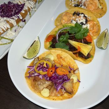 Malinche Mexican Culinary Experience - Left: Flautas. Tacos: El de Camarón (shrimp) tacos, vegetarian taco, and El de Pescado (mahi) taco - Mexican Near Me - Ellisville, Missouri Malinche Mexican Culinary Experience - Left: Flautas. Tacos: El de Camarón (shrimp) tacos, vegetarian taco, and El de Pescado (mahi) taco - Mexican Near Me - Ellisville, Missouri