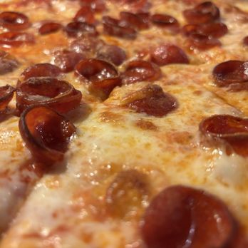 Scarpino's Classic Italian - Pepperoni pizza emphasizing the small pepperoni cups - Italian Near Me - Bradenton, Florida Scarpino's Classic Italian - Pepperoni pizza emphasizing the small pepperoni cups - Italian Near Me - Bradenton, Florida