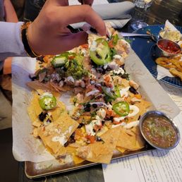 Chicken nachos. Lemon drop pictured in back. Chicken nachos. Lemon drop pictured in back.