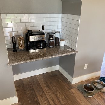 Home Service Pros - a kitchen counter with a coffee maker - Flooring Near Me
