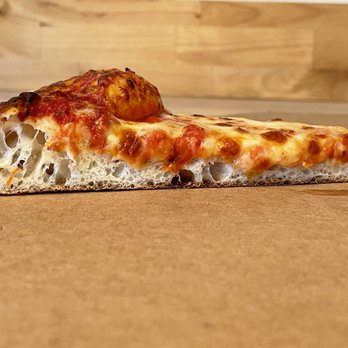 Kay Jack Pizza - a slice of pizza on a table - Pizza Near Me - Madison, Ohio Kay Jack Pizza - a slice of pizza on a table - Pizza Near Me - Madison, Ohio