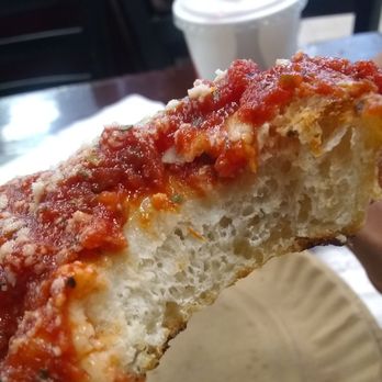 Famous Ben's Pizza - Close close up of the upside down pizza slice - Pizza Near Me - New York, New York Famous Ben's Pizza - Close close up of the upside down pizza slice - Pizza Near Me - New York, New York