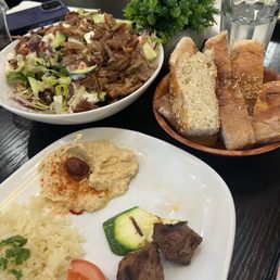 Clockwise: Gyro Greek Salad, home made bread, and Lamb Kebab (Highly Recommended)