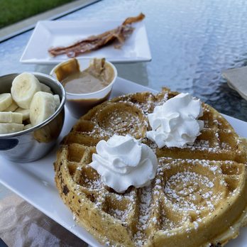 Just Love Coffee Cafe - Murfreesboro West - Not-So-Plain Jane waffle and a side of bacon. - Coffee & Tea Near Me - Murfreesboro, Tennessee