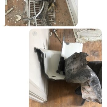 Quick Clean Outs - The image depicts two damaged chairs and a metal rack in a room with wooden flooring. One chair is white with a black armrest, and the other appears to be a black plastic chair with significant damage. The metal rack is upright and appears to be part of a shelving unit. Debris and broken pieces are scattered on the floor, and a curtain is partially visible in the background. The setting suggests a space that has experienced damage or disrepair. - Junk Removal & Hauling Near Me