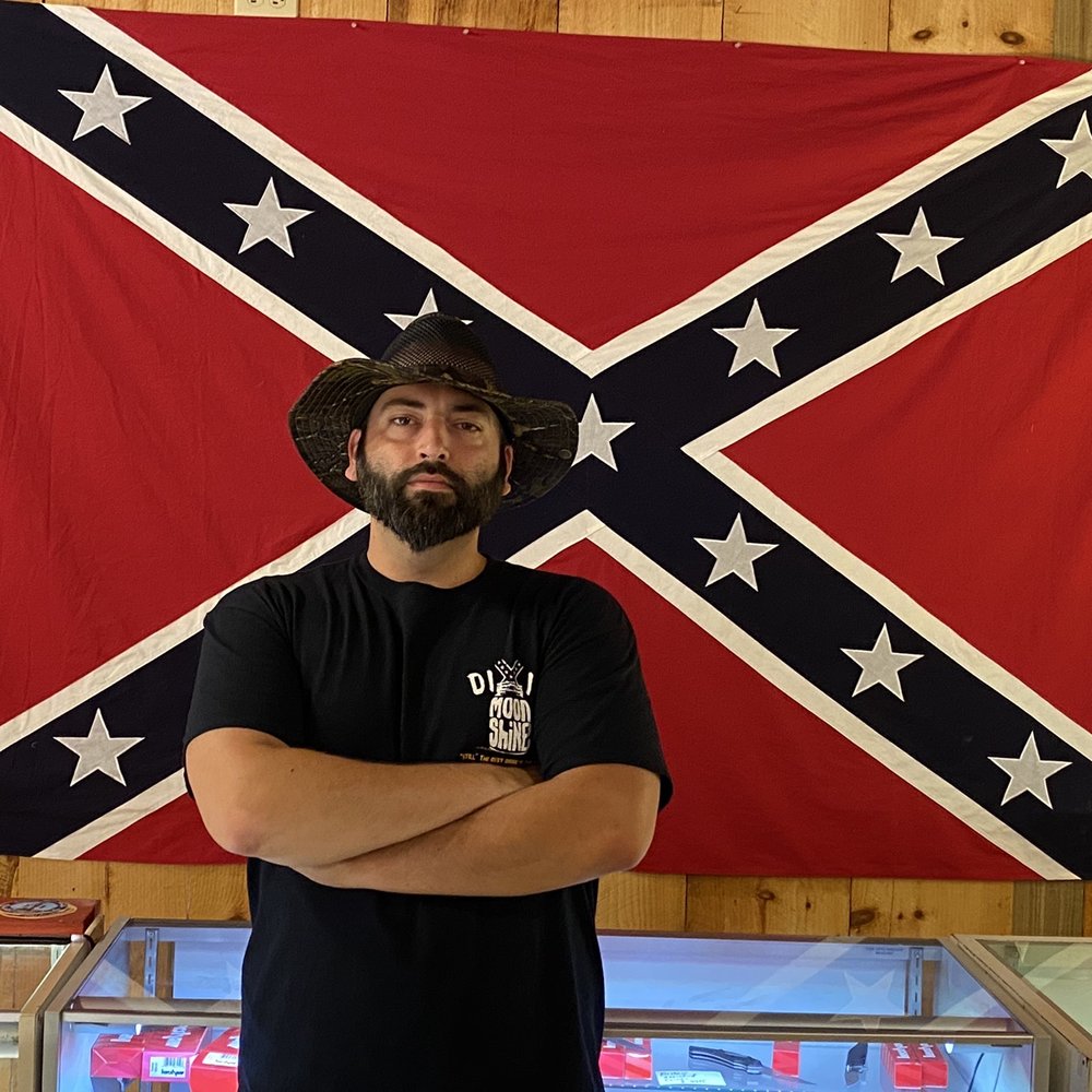 Myself and a battle flag at Dixie Republic. Myself and a battle flag at Dixie Republic.