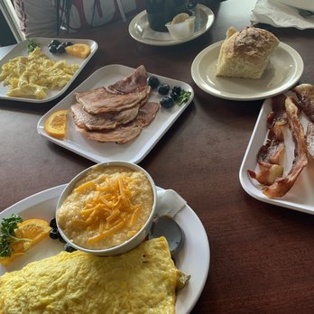 Biscuits & Gravy - Mexican omelette, Cheesy grits, crispy bacon, biscuits, ham, and scrabbled eggs. - Breakfast & Brunch Near Me - Canton, Michigan Biscuits & Gravy - Mexican omelette, Cheesy grits, crispy bacon, biscuits, ham, and scrabbled eggs. - Breakfast & Brunch Near Me - Canton, Michigan