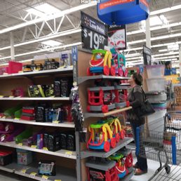 a woman shopping in a walmart supercenter a woman shopping in a walmart supercenter