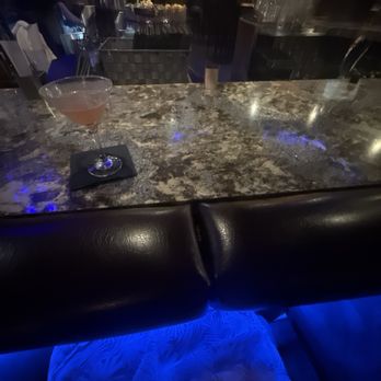 Nona Blue Modern Tavern - Comfy cushions near the bar for armrest - Bars Near Me - Orlando, Florida
