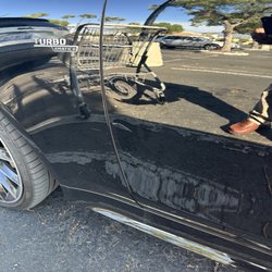 Car door being hit by a supermarket cart