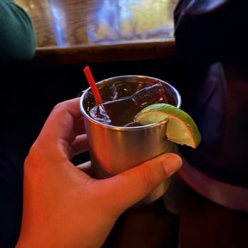The Blind Pig - a person holding a cup with a drink in it - Dive Bars Near Me - Charlotte, North Carolina The Blind Pig - a person holding a cup with a drink in it - Dive Bars Near Me - Charlotte, North Carolina