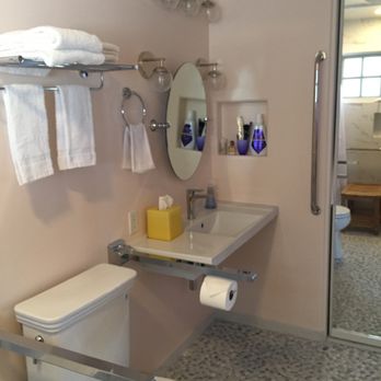 R & M Construction Inc - New bathroom with wall-mounted and reinforced sink, tilting mirror, universal toilet with flip up grab bars - General Contractors Near Me - San Diego, California R & M Construction Inc - New bathroom with wall-mounted and reinforced sink, tilting mirror, universal toilet with flip up grab bars - General Contractors Near Me - San Diego, California